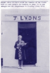 Julia Clifford poses in front of Lyons' with the fiddle that was kept there for Padraig O'Keeffe